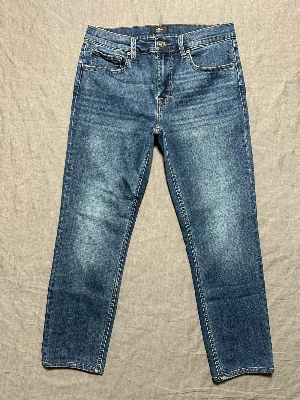 7 For All Mankind Men’s Tapered Jeans in Medium Blue Denim